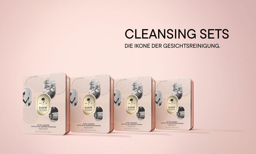 Werbebanner der BABOR HY-ÖL Cleansing Sets: vier roségoldene Metalldosen nebeneinander vor rosé Hintergrund.